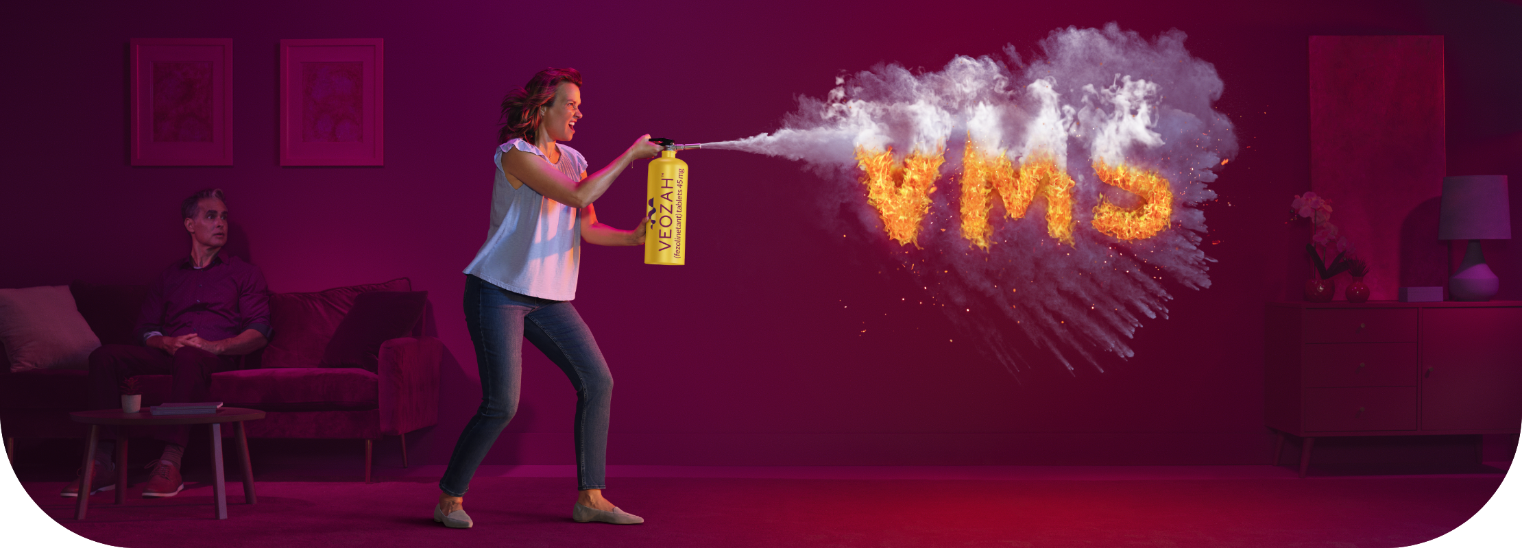 Woman spraying VEOZAHTM (fezolinetant) logo fire extinguisher at VMS fire