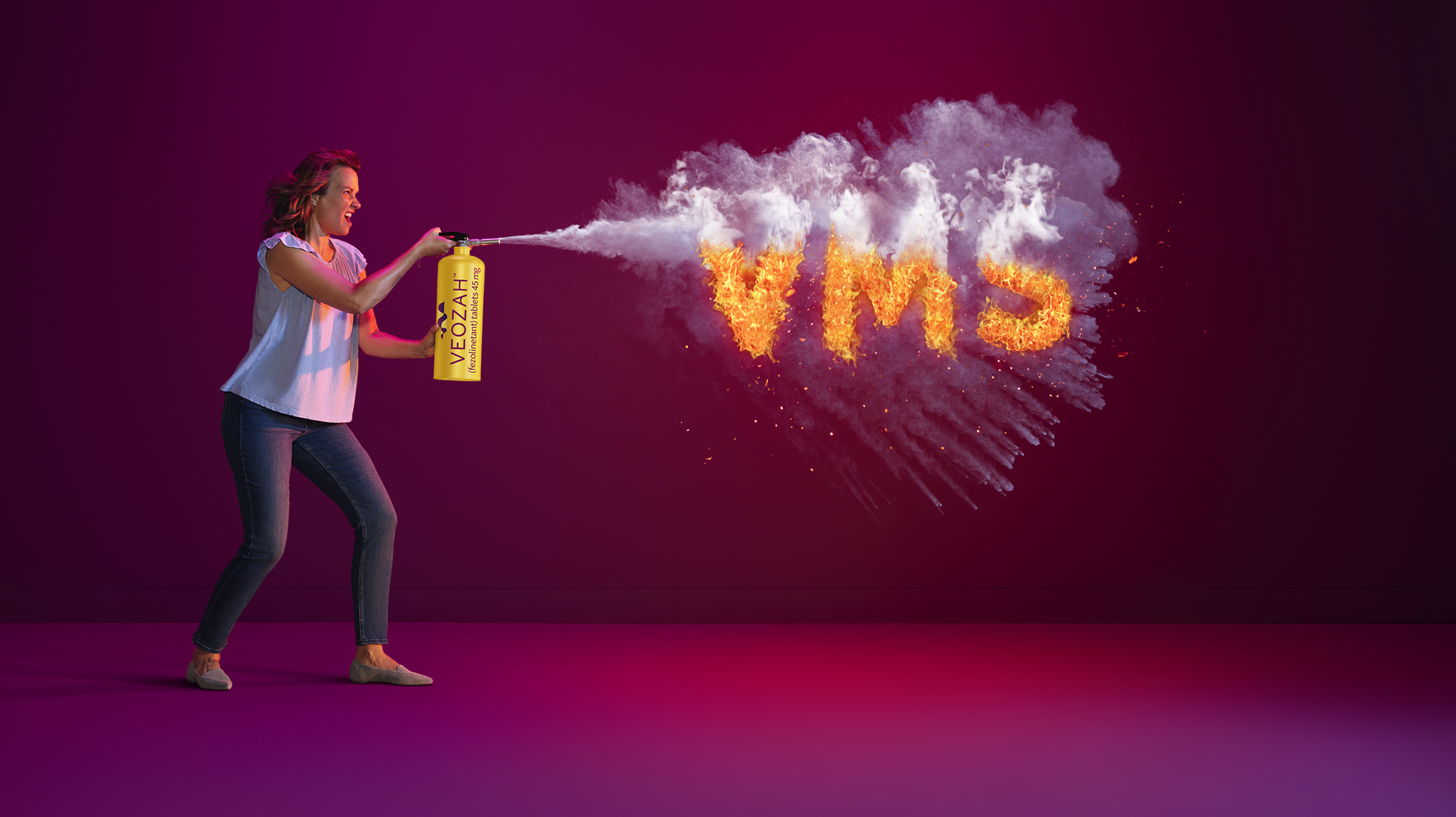  Woman spraying VEOZAHTM (fezolinetant) logo fire extinguisher at VMS fire