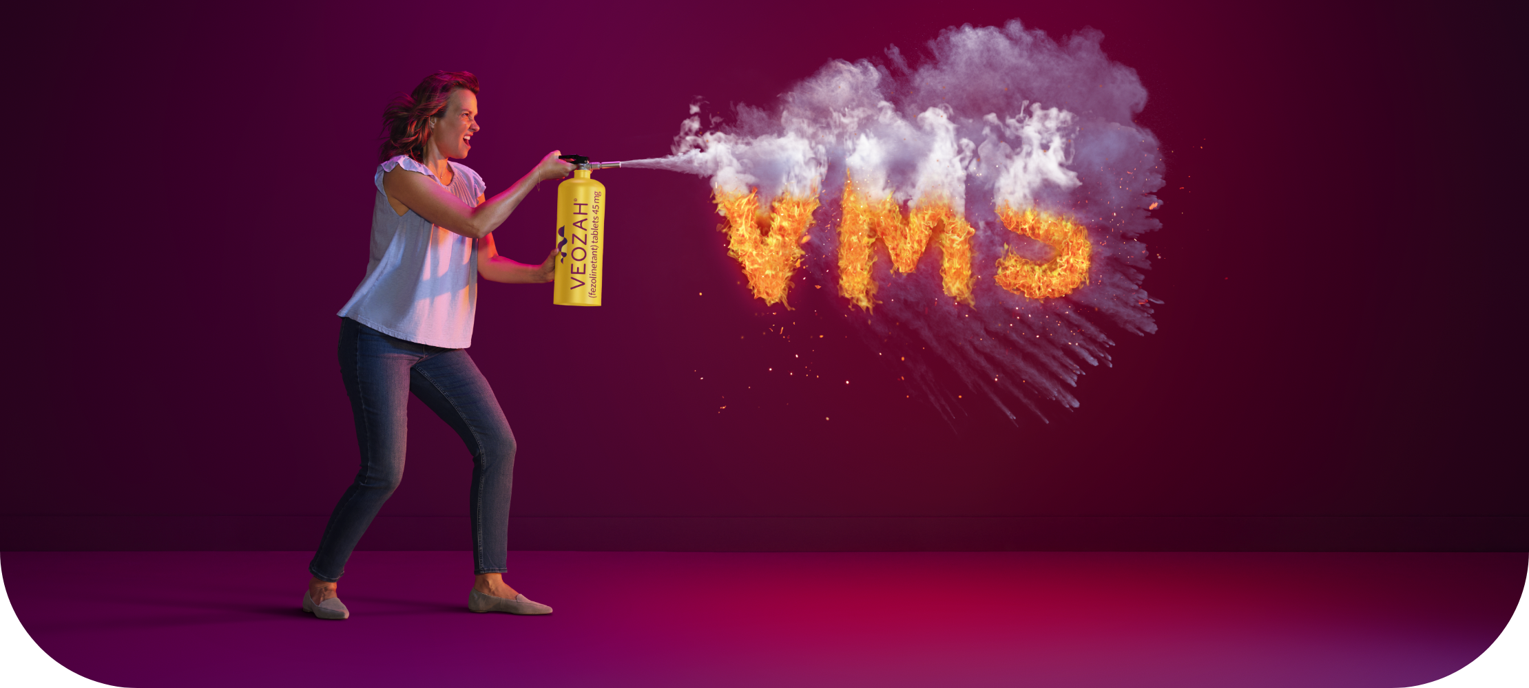 Woman spraying VEOZAH® (fezolinetant) logo fire extinguisher at VMS fire