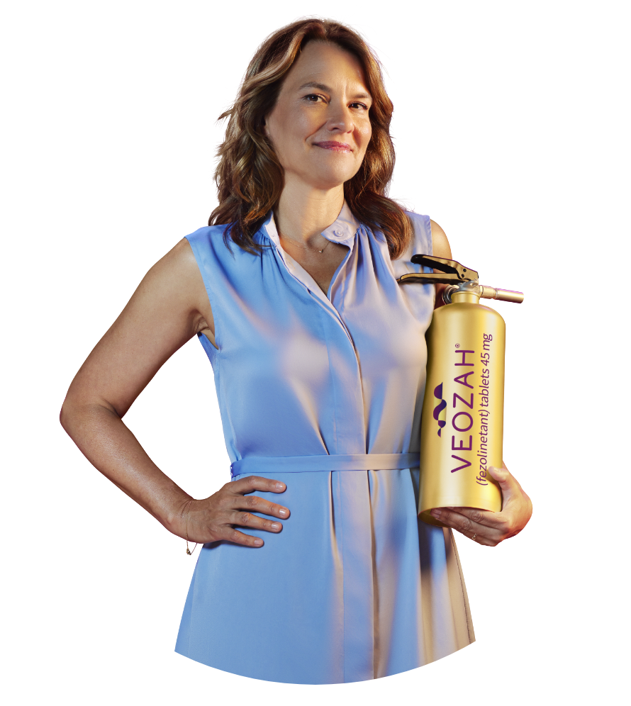 Woman holding VEOZAH® (fezolinetant) logo fire extinguisher with smoke behind her