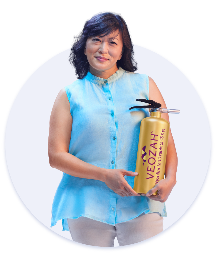 Woman holding VEOZAHTM (fezolinetant) logo fire extinguisher