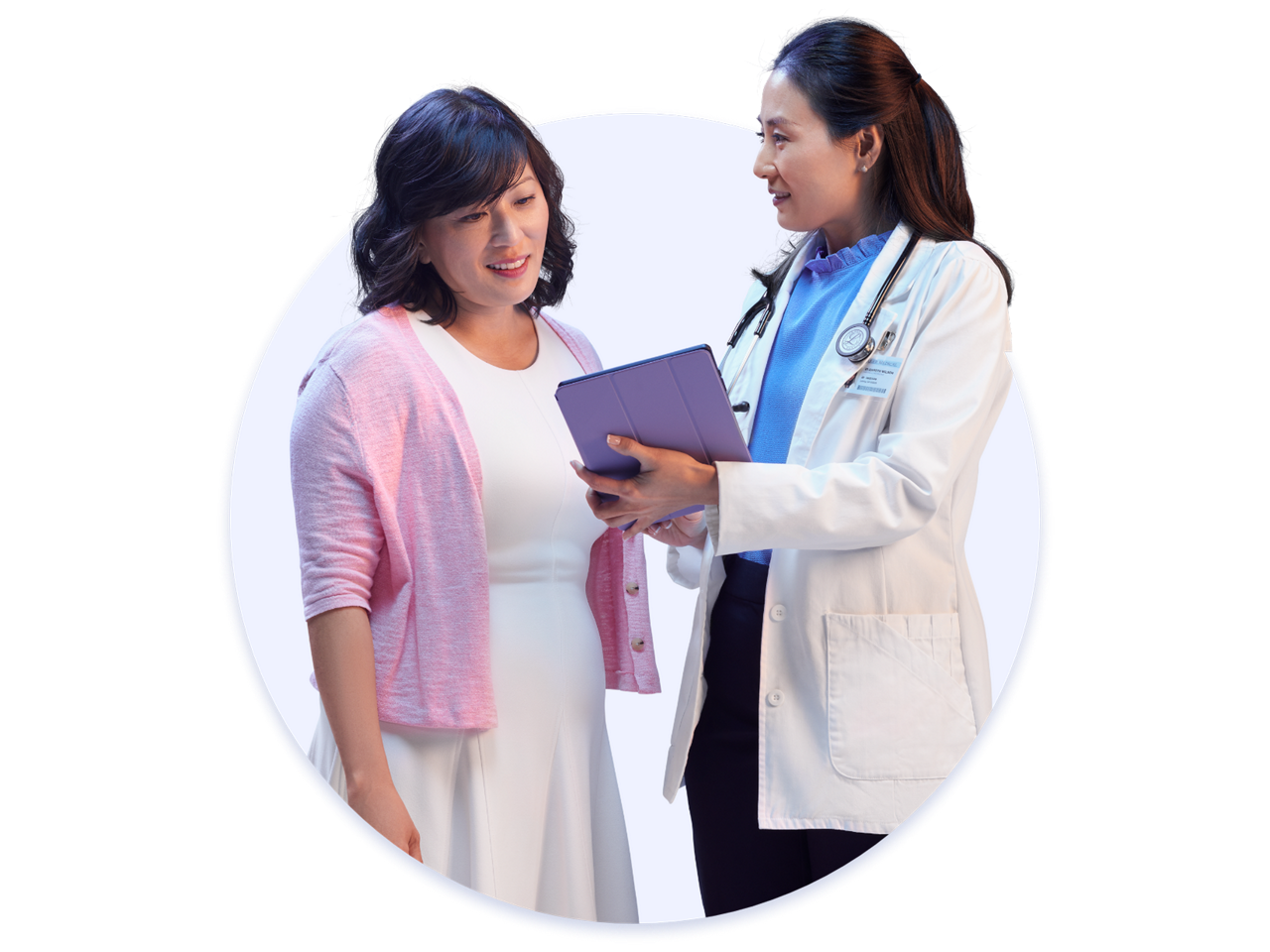 Woman and doctor looking at iPad